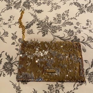 BCBG gold sequence wristlet. With tags
